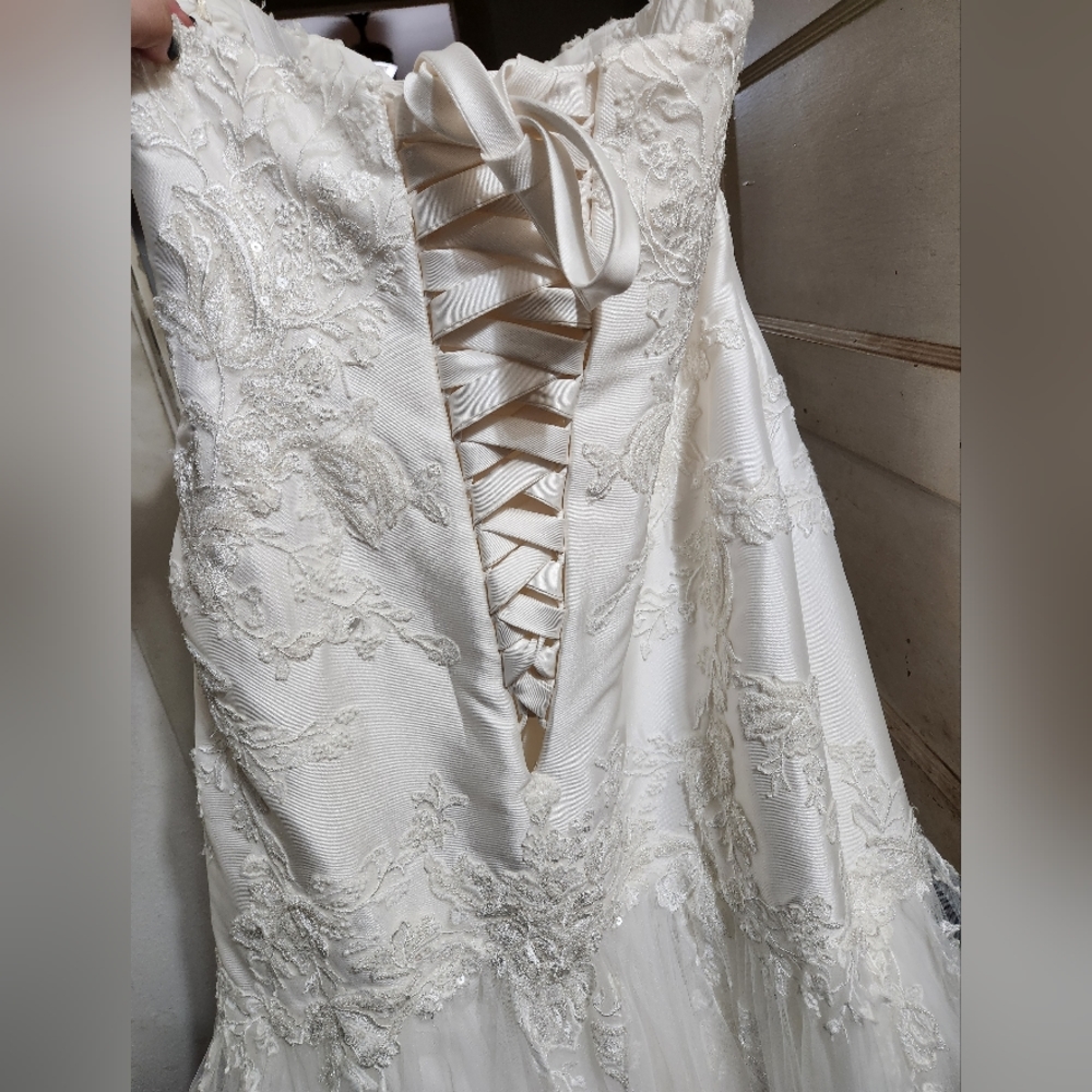 This is a Essence of Australia wedding gown, size 22, with a corset back, ivory